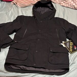 The North Face Men's Black Performance Jacket, with a bag